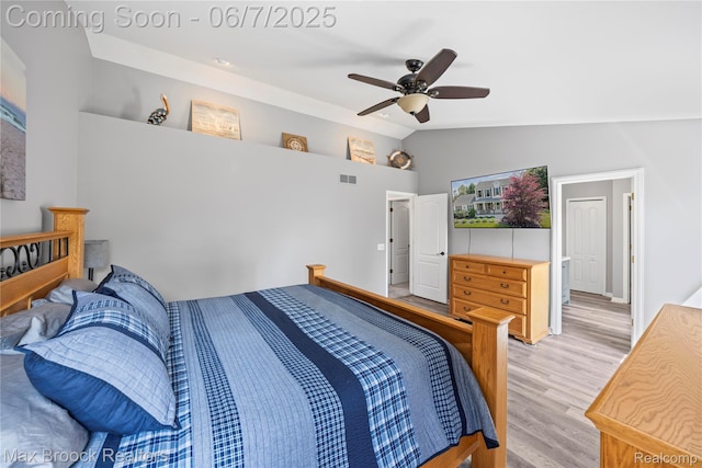 9863 Marshall Rd, South Lyon, MI 48178 - bedroom with lofted ceiling, light wood-style floors, and ceiling fan