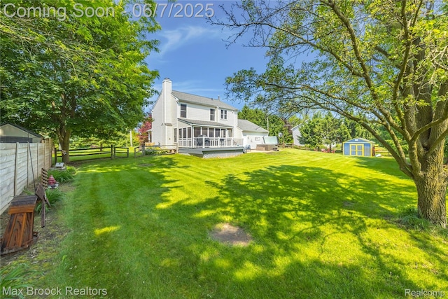 9863 Marshall Rd, South Lyon, MI 48178 - view of yard featuring a sunroom and a deck