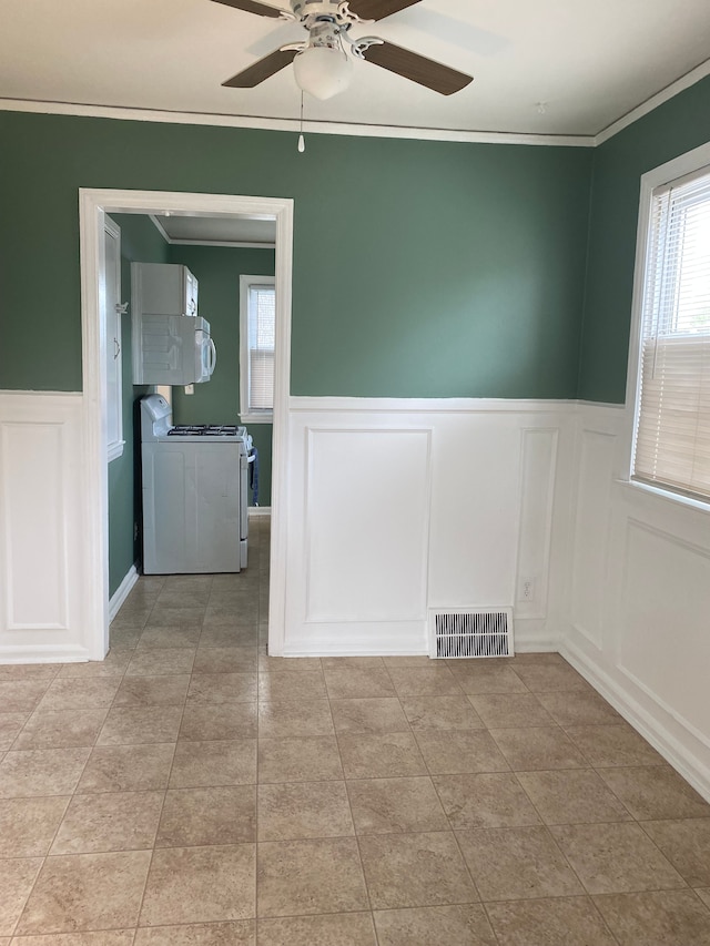 13020 Castle St, Southgate, MI 48195 - unfurnished room featuring a decorative wall, crown molding, a wainscoted wall, a ceiling fan, and light tile patterned flooring