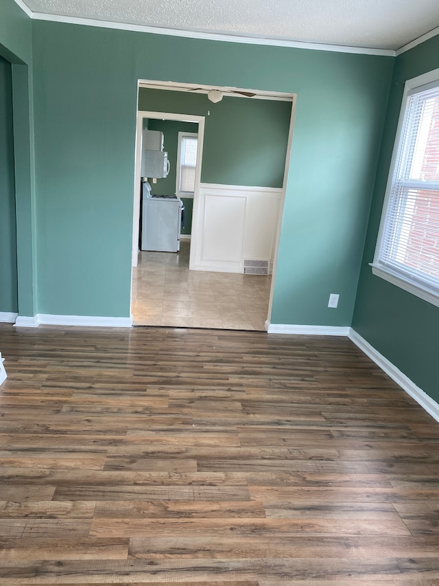 13020 Castle St, Southgate, MI 48195 - unfurnished room with wood finished floors, ornamental molding, a textured ceiling, and baseboards