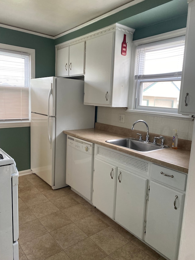 13020 Castle St, Southgate, MI 48195 - kitchen with white appliances, a sink, backsplash, and white cabinets