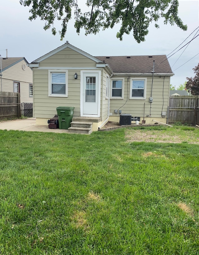 13020 Castle St, Southgate, MI 48195 - back of house featuring central air condition unit, a patio area, and entry steps