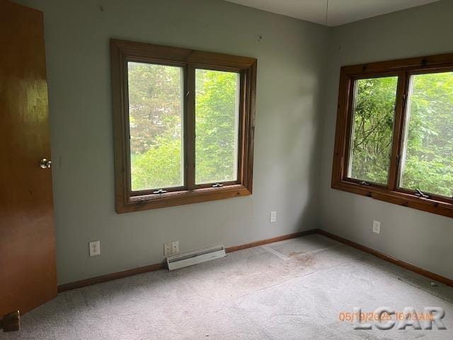 6730 Summerfield Rd, Temperance, MI 48182 - unfurnished room featuring a baseboard heating unit, carpet, and baseboards