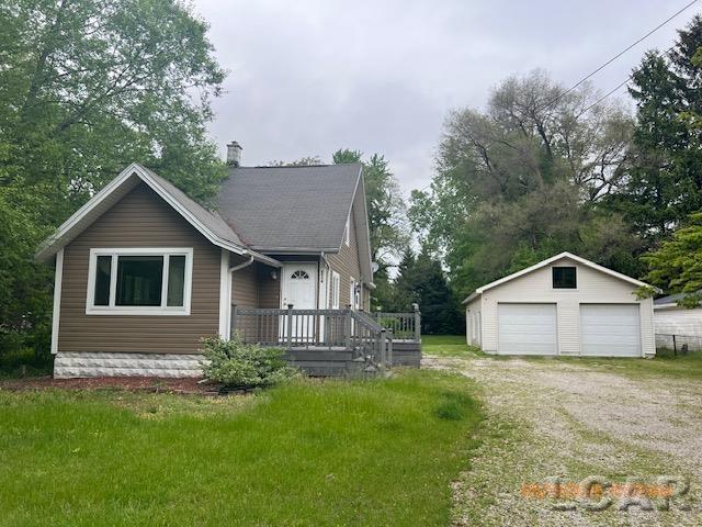 6730 Summerfield Rd, Temperance, MI 48182 - view of front of property with a garage, an outdoor structure, and a front lawn