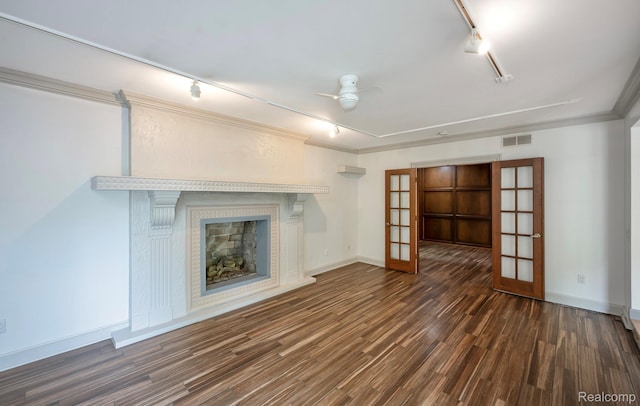 2264 W Maple Rd, Bloomfield Hills, MI 48301 - unfurnished living room with rail lighting, french doors, wood finished floors, ceiling fan, and a fireplace