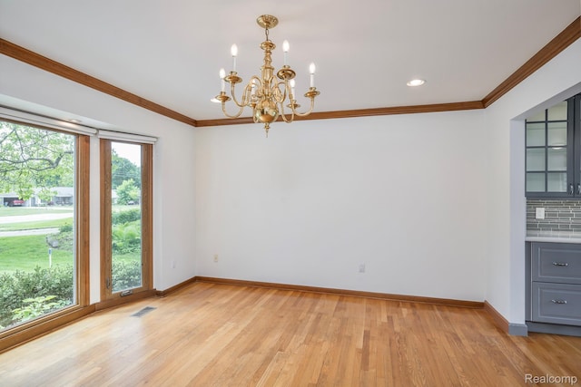 2264 W Maple Rd, Bloomfield Hills, MI 48301 - unfurnished dining area featuring baseboards, a chandelier, light wood-style floors, and crown molding