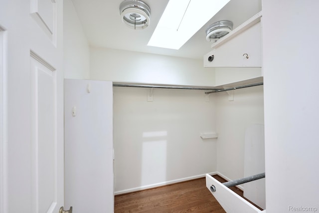2264 W Maple Rd, Bloomfield Hills, MI 48301 - spacious closet featuring a skylight and wood finished floors