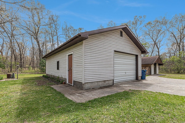 7719 Guenthardt Rd, Manistee, MI 49660 - detached garage with asphalt driveway