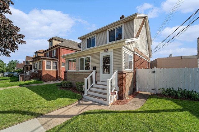50 Elm St, River Rouge, MI 48218 - view of front of house featuring brick siding, a gate, and a chimney