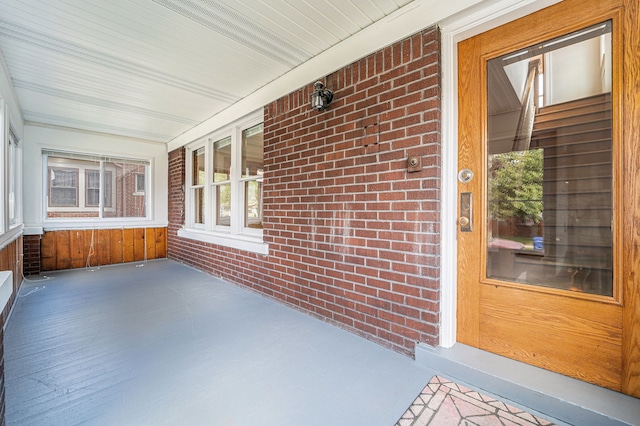 50 Elm St, River Rouge, MI 48218 - unfurnished sunroom with brick wall, plenty of natural light, and wooden walls