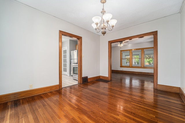 50 Elm St, River Rouge, MI 48218 - spare room featuring a chandelier, wood finished floors, and baseboards