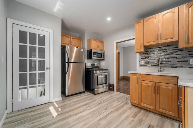 50 Elm St, River Rouge, MI 48218 - kitchen with stainless steel appliances, a sink, baseboards, light countertops, and recessed lighting