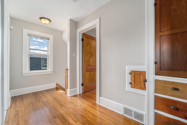 50 Elm St, River Rouge, MI 48218 - hall with light wood-style flooring and baseboards
