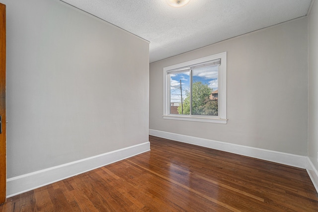 50 Elm St, River Rouge, MI 48218 - unfurnished room featuring baseboards, wood finished floors, and a textured ceiling