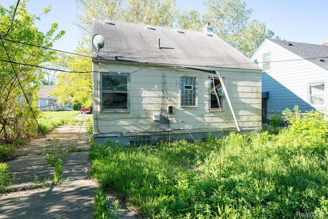15693 Liberal St, Detroit, MI 48205 - rear view of house featuring roof with shingles