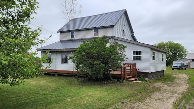 3483 80th Ave, Lakeview, MI 48850 - back of house featuring a yard, metal roof, and a deck