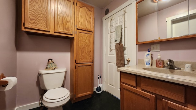 3483 80th Ave, Lakeview, MI 48850 - bathroom featuring toilet, vanity, and baseboards