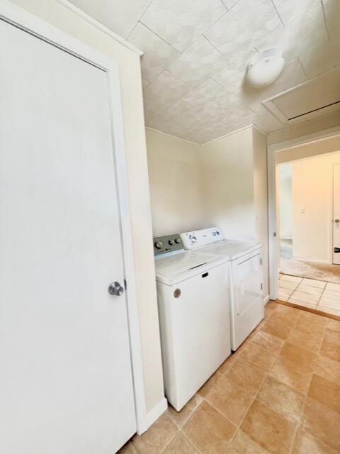 laundry room with washing machine and clothes dryer