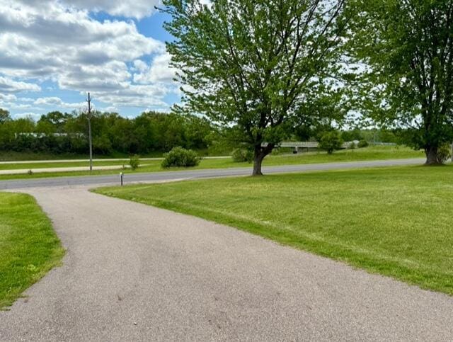 surrounding community with a lawn