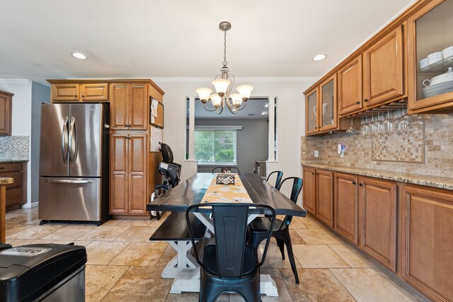 1255 Meadowood Dr, Waterford, MI 48327 - kitchen with freestanding refrigerator, brown cabinets, a chandelier, tasteful backsplash, and ornamental molding