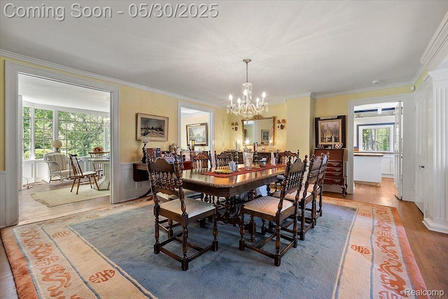 16109 E Jefferson Ave, Grosse Pointe Park, MI 48230 - dining space with a chandelier, crown molding, and wood finished floors