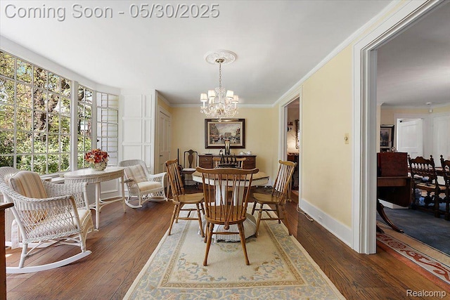 16109 E Jefferson Ave, Grosse Pointe Park, MI 48230 - dining area with a chandelier, crown molding, wood-type flooring, and baseboards