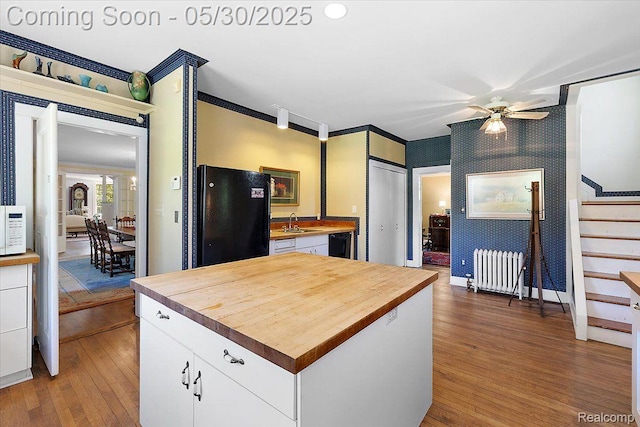 16109 E Jefferson Ave, Grosse Pointe Park, MI 48230 - kitchen featuring freestanding refrigerator, wooden counters, radiator heating unit, dishwashing machine, and wallpapered walls