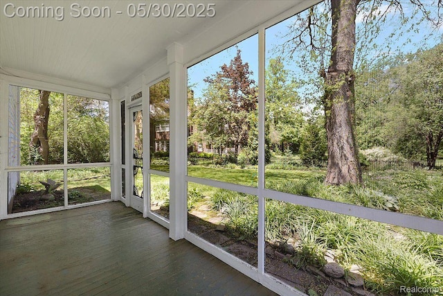 16109 E Jefferson Ave, Grosse Pointe Park, MI 48230 - unfurnished sunroom featuring wood finished floors and view of scattered trees