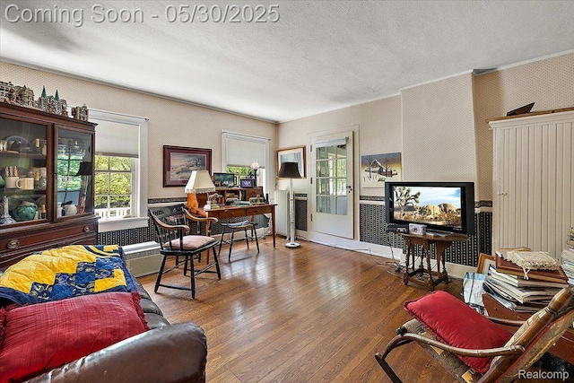 16109 E Jefferson Ave, Grosse Pointe Park, MI 48230 - living area featuring a textured ceiling, wood finished floors, and crown molding