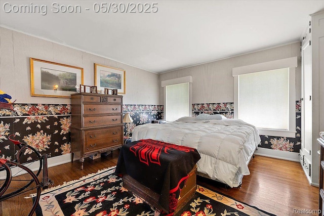 16109 E Jefferson Ave, Grosse Pointe Park, MI 48230 - bedroom with wood finished floors, ornamental molding, and baseboards