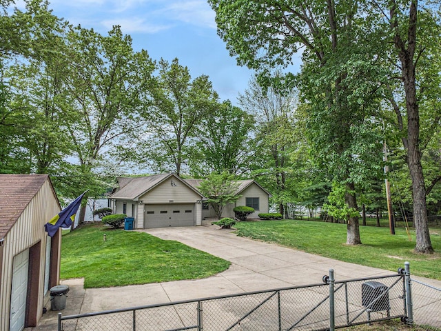 view of front of house with concrete driveway and an attached garage