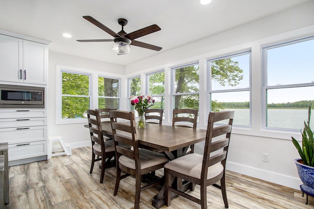 dining space featuring baseboards, a ceiling fan, healthy amount of natural light, and recessed lighting