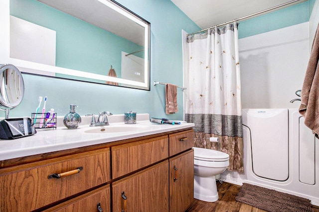 full bath with toilet, wood finished floors, vanity, and a shower with curtain