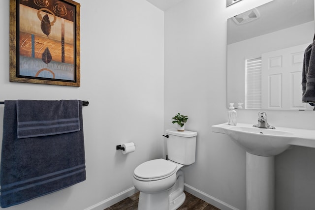 25596 Forest Dr, Mattawan, MI 49071 - bathroom with wood finished floors, toilet, and baseboards