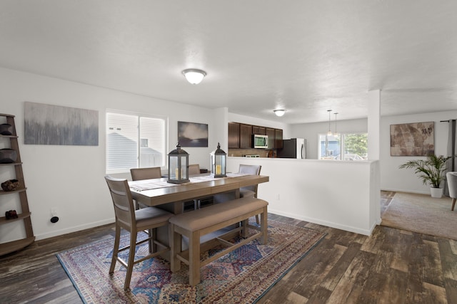 25596 Forest Dr, Mattawan, MI 49071 - dining area with dark wood-type flooring and baseboards