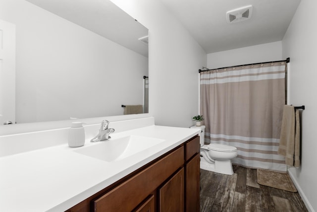 25596 Forest Dr, Mattawan, MI 49071 - bathroom with wood finished floors, toilet, vanity, and curtained shower