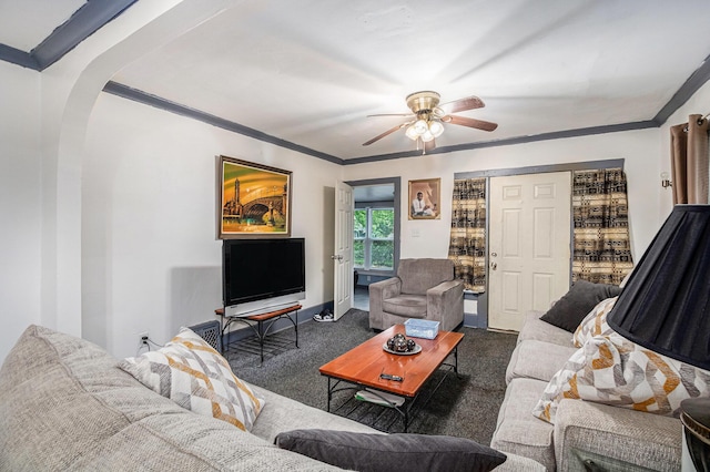 791 La Salle St, Benton Harbor, MI 49022 - carpeted living room featuring arched walkways, a ceiling fan, ornamental molding, and baseboards