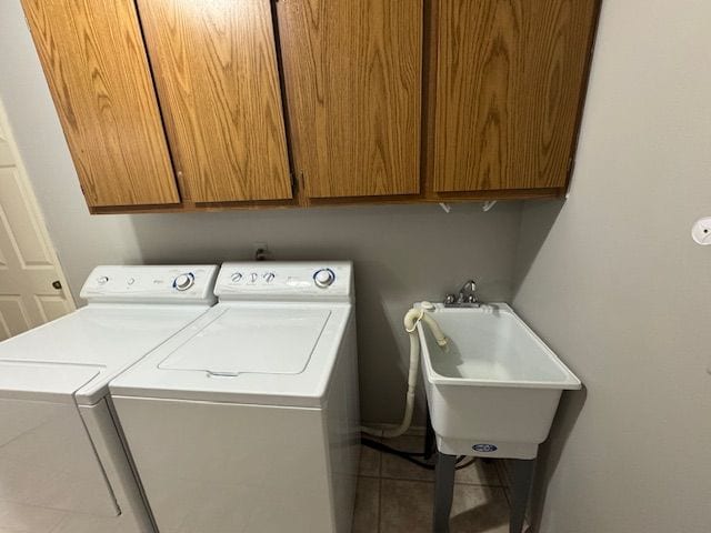 20433 Birch Meadow Dr, Clinton Township, MI 48036 - washroom with independent washer and dryer, cabinet space, and tile patterned floors