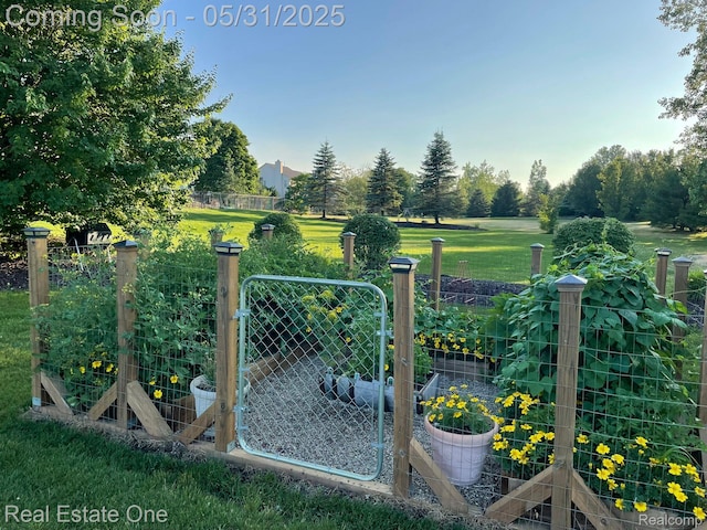 3088 Exeter Dr, Milford, MI 48380 - gate featuring a garden