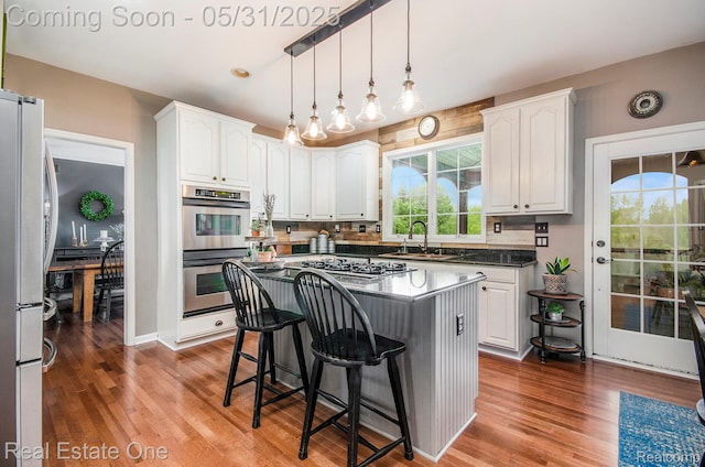 3088 Exeter Dr, Milford, MI 48380 - kitchen with appliances with stainless steel finishes, a sink, and white cabinetry