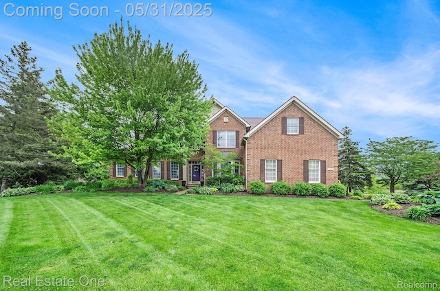 3088 Exeter Dr, Milford, MI 48380 - view of front of house with brick siding and a front lawn