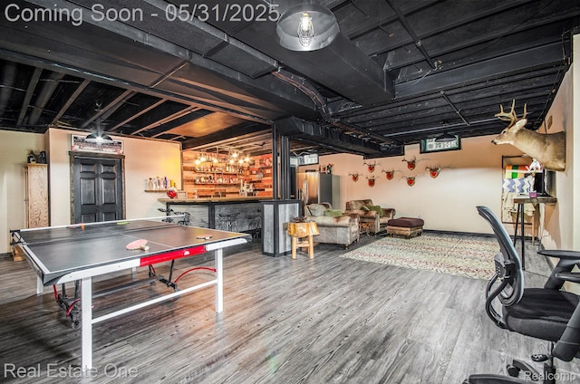 3088 Exeter Dr, Milford, MI 48380 - playroom featuring wood finished floors, a dry bar, and baseboards