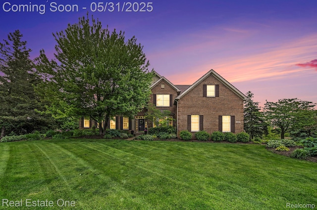 3088 Exeter Dr, Milford, MI 48380 - traditional-style home with brick siding and a lawn