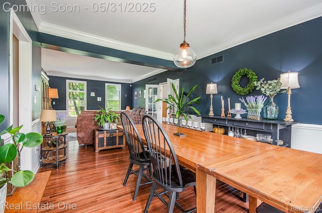 3088 Exeter Dr, Milford, MI 48380 - dining area with ornamental molding and wood finished floors