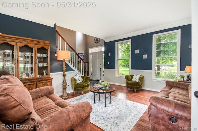 3088 Exeter Dr, Milford, MI 48380 - living area with wood finished floors, crown molding, stairway, and baseboards