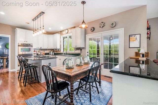 3088 Exeter Dr, Milford, MI 48380 - dining room with wood finished floors, recessed lighting, and baseboards
