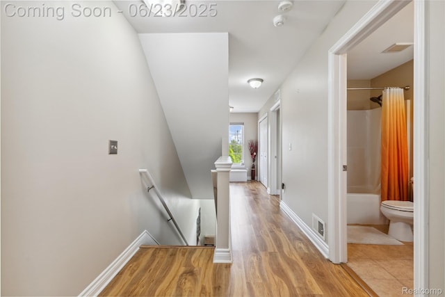 750 2nd St Unit 27, Wyandotte, MI 48192 - corridor with an upstairs landing and light wood-style flooring