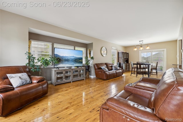 750 2nd St Unit 27, Wyandotte, MI 48192 - living room with a chandelier and light wood finished floors