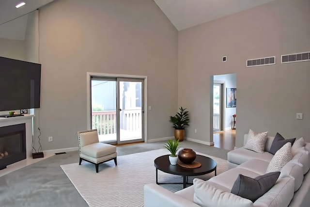 37695 Burton Dr, Farmington Hills, MI 48331 - living room featuring high vaulted ceiling, carpet floors, baseboards, and a fireplace with flush hearth