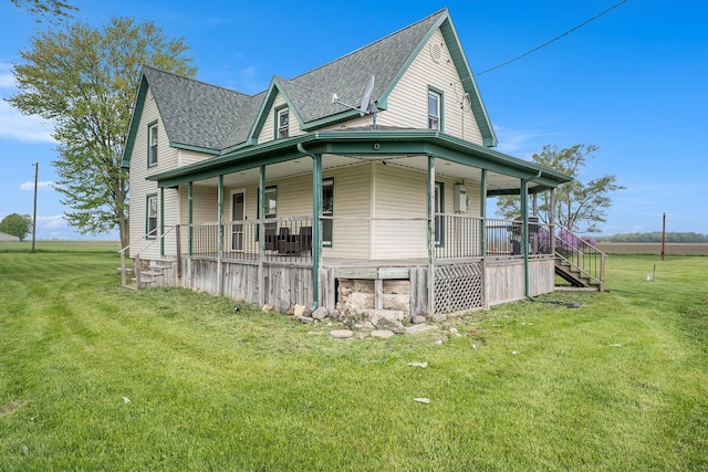7917 E Harrison Rd, Breckenridge, MI 48615 - view of side of home featuring covered porch, roof with shingles, a yard, and stairway